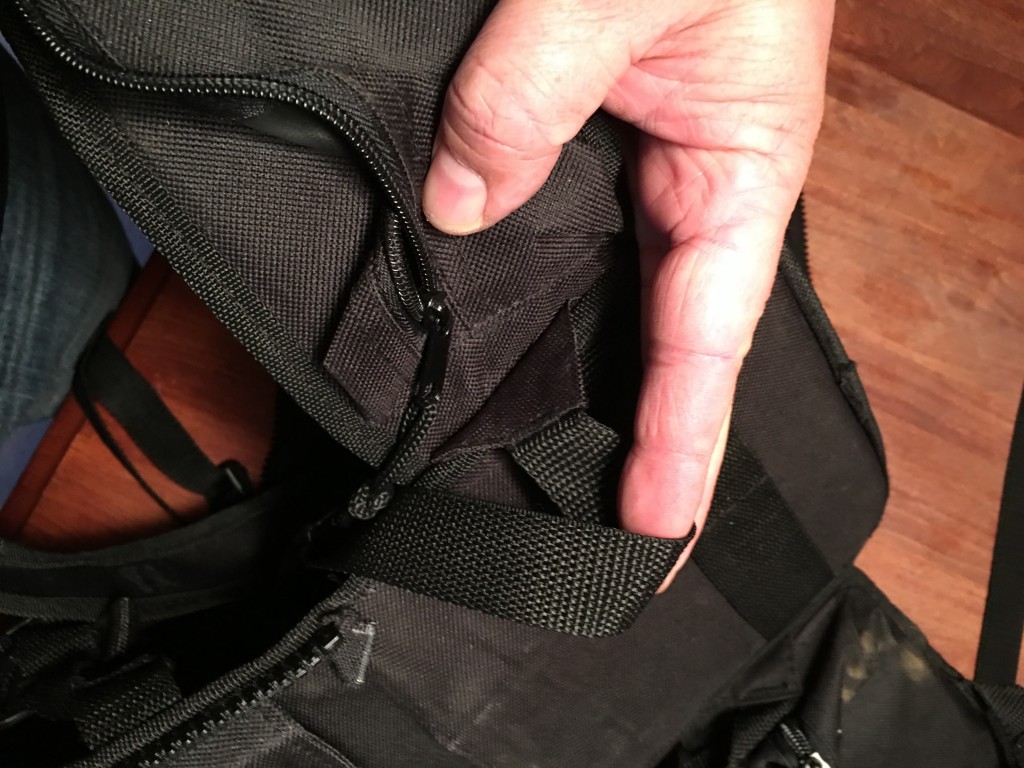 Where the hip-belt meets the body - there is a small triangle that holds the bottom webbing for the shoulder strap - need this, don't cut it off!